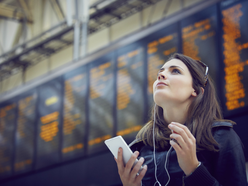 Woman At A Train Station